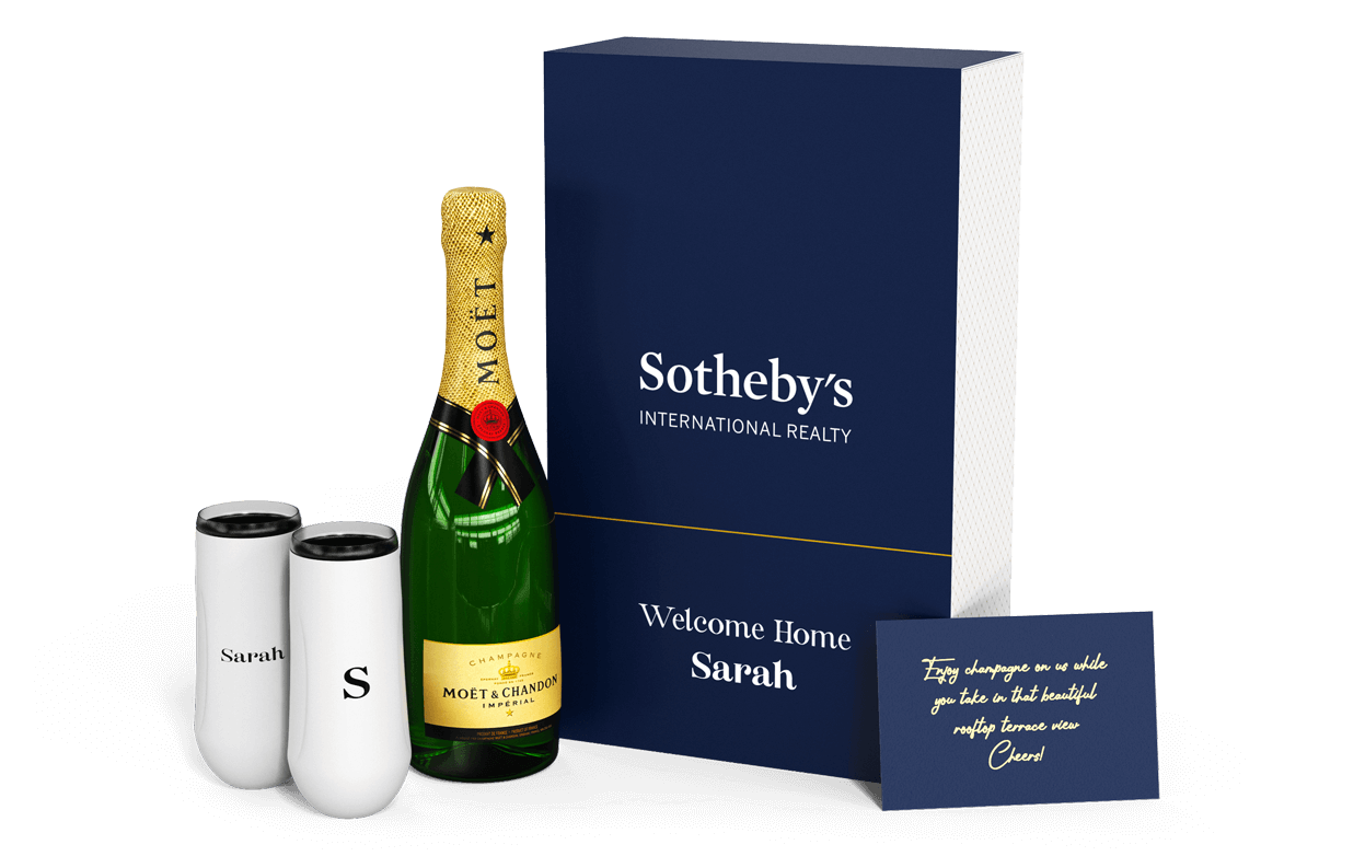 Insulated champagne flutes with a bottle of champagne and custom gift box